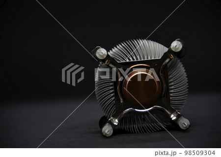 Aluminum radiator for cooling the computer processor on a black background. CPU cooling. 98509304
