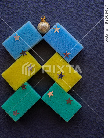 Christmas tree made of items for cleaning for a holiday postcard 98509437