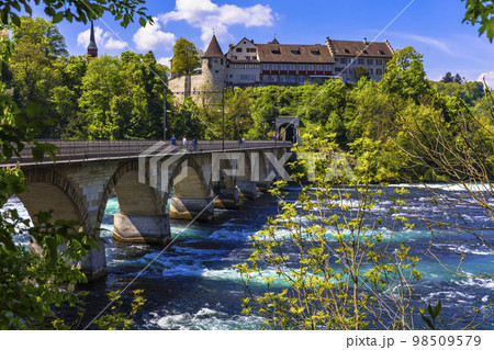 Rheinfall (Rhine Falls) biggest waterfall in Europe in Schaffhausen , view of Laufen castle and bridge . Switzerland Rheinfall (Rhine Falls) biggest waterfall in Europe in Schaffhausen , view of Laufen castle and bridge . Switzerland 98509579