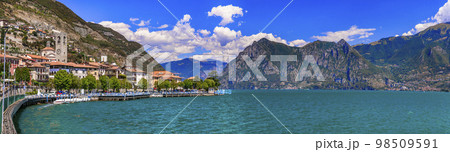 Romantic beautiful lake Iseo, aerial view of Riva di Solto- idyllic village surrounded by mountains. Italy , Bergamo province. 98509591