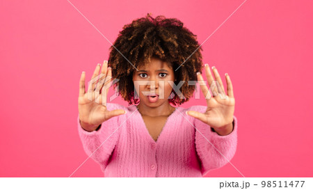 Angry sad confident millennial african american curly lady in casual show hands stop sign 98511477