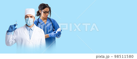 International medical team working on blue background, copy space 98511580
