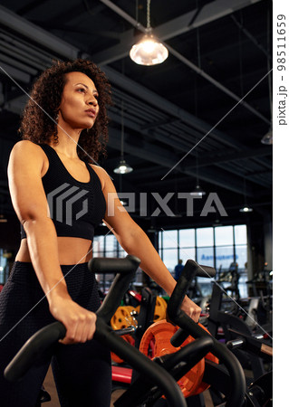 african american woman cardio for weight loss aerobics cycling workout 98511659