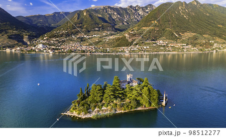 Amazing lake Iseo scenery with picturesque small island Loreto with castle, aerial drone view. Italy Amazing lake Iseo scenery with picturesque small island Loreto with castle, aerial drone view. Italy 98512277