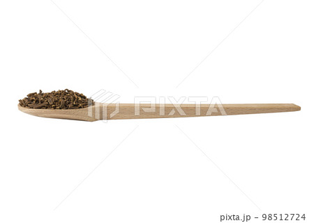 Valerian herb root on wooden spoon isolated on white background. Valeriana officinalis. used in herbal medicine as a tranquillizer and to treat insomnia, anxiety, hypertension, pain relief. 98512724
