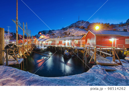 Fabulous evening seascape of Norwegian sea and cityscape of Nusfjord village. Fabulous evening seascape of Norwegian sea and cityscape of Nusfjord village. 98514262