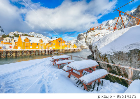 Awesome morning seascape of Norwegian sea and cityscape of Nusfjord village. Awesome morning seascape of Norwegian sea and cityscape of Nusfjord village. 98514375