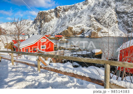 Amazing morning seascape of Norwegian sea and cityscape of Nusfjord village. Amazing morning seascape of Norwegian sea and cityscape of Nusfjord village. 98514383