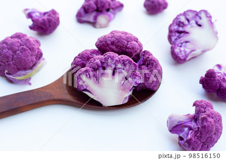Purple cauliflower on white background. 98516150