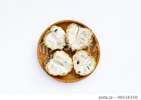 Custard apple in white plate on white background. 98516356