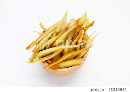 Sliced finger root on white background. Sliced finger root on white background. 98516632