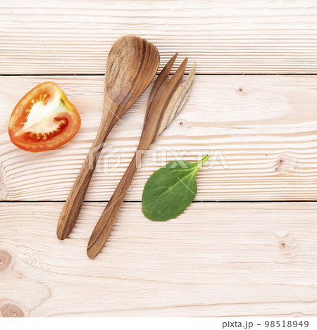 Food background and salad concept with raw ingredients flat lay on white wooden background. Food background and salad concept with raw ingredients flat lay on white wooden background. 98518949