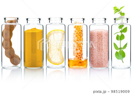 The glass bottle of homemade skin care and body scrubs with natural ingredients aloe vera ,himalayan salt ,peppermint ,rosemary ,turmeric and honey isolate on white background. The glass bottle of homemade skin care and body scrubs with natural ingredients aloe vera ,himalayan salt ,peppermint ,rosemary ,turmeric and honey isolate on white background. 98519009