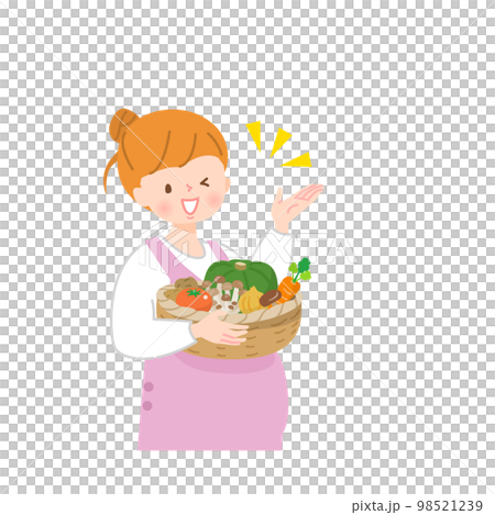 籠に入った野菜を持った若い妊婦さん 98521239