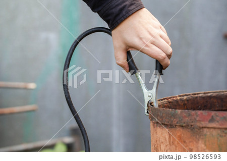 Welding terminal clamp in the welding cable for earth. Close-up, industry 98526593