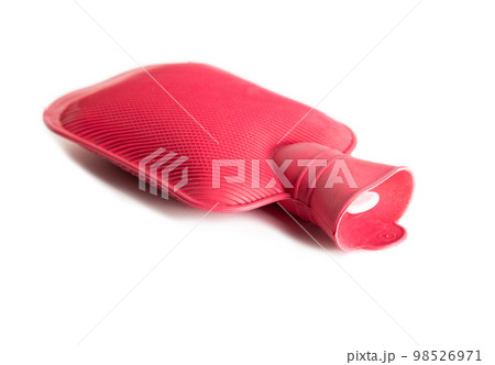 Red medical heating pad with hot water on a white background, isolate. Close-up, object Red medical heating pad with hot water on a white background, isolate. Close-up, object 98526971