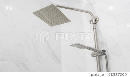 Modern square shower head with large and small head. Copy space for text, chrome Modern square shower head with large and small head. Copy space for text, chrome 98527209