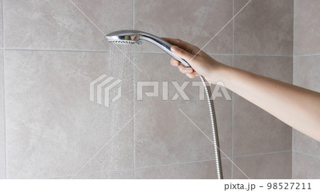 Hand shower head with water jet pressure switch. Hygiene and freshness. Copy space for text, spray Hand shower head with water jet pressure switch. Hygiene and freshness. Copy space for text, spray 98527211