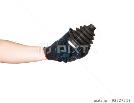 A car mechanic in a glove holds a car boot of a CV joint on a white background, isolate. CV joint repair, close-up 98527218
