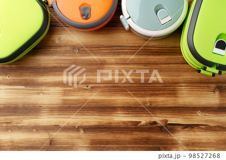 New empty plastic lunch box on a wooden background New empty plastic lunch box on a wooden background 98527268
