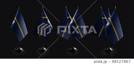 Small national flags of the Nauru on a black background 98527867