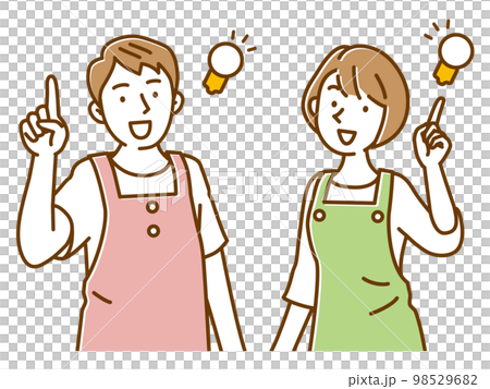 いいこと思いついたエプロンの若い保育士の男女 いいこと思いついたエプロンの若い保育士の男女 98529682