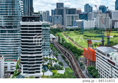Bangkok Aerial Skyline and Skytrain view of Thailand. Business and financial building area centers with smart green park among urban city at noon time. Bangkok Aerial Skyline and Skytrain view of Thailand. Business and financial building area centers with smart green park among urban city at noon time. 98531655