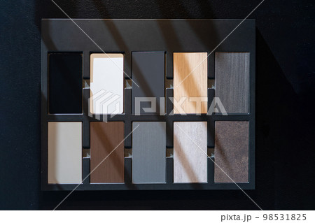 Material Example of wood type and colour for customer in kitchen showroom, show texture and design of their material. Material Example of wood type and colour for customer in kitchen showroom, show texture and design of their material. 98531825