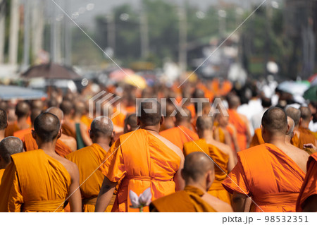 a group of monk on pilgrimage walk on the street at noon time, Thailand. 98532351