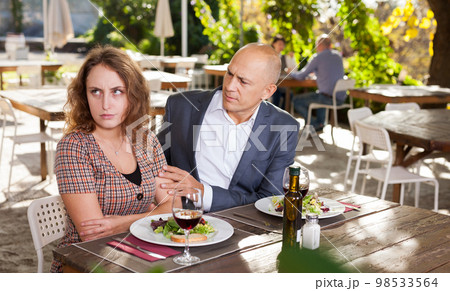 Family quarrel during lunch in an open-air restaurant Family quarrel during lunch in an open-air restaurant 98533564