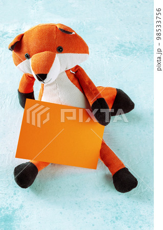 Mockup for an orange card with a toy fox. A greeting card or invitation Mockup for an orange card with a toy fox. A greeting card or invitation 98533756