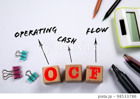 OCF - Operating Cash Flow. Wooden blocks on a white office table 98533786