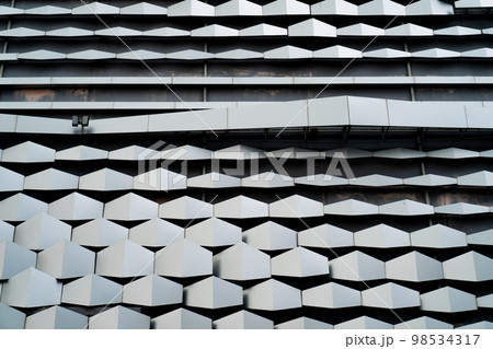 modern Aluminium composite material architecture gray color and Hexagon shape popup texture on exterior facade building. modern Aluminium composite material architecture gray color and Hexagon shape popup texture on exterior facade building. 98534317