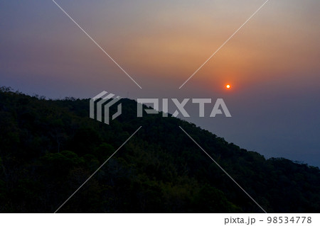 PM 2.5 in Sunrise view with the mountain foreground at Chiang Rai province, North of Thailand on 25 Mar 2021 morning 7.00 am. PM 2.5 in Sunrise view with the mountain foreground at Chiang Rai province, North of Thailand on 25 Mar 2021 morning 7.00 am. 98534778