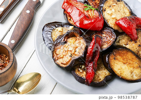 Grilled juicy vegetables on a plate. 98538787
