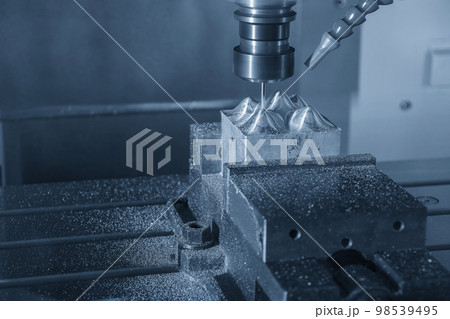 The CNC milling machine cutting injection sample part by solid ball end mill tool. 98539495