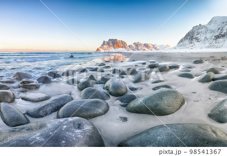 Astonishing winter scenery on Uttakleiv beach at sunset time. 98541367