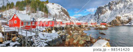 Amazing morning seascape of Norwegian sea and cityscape of Nusfjord village. Amazing morning seascape of Norwegian sea and cityscape of Nusfjord village. 98541420