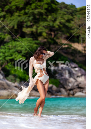 Sexy Slim woman Posing at the beach 98544301