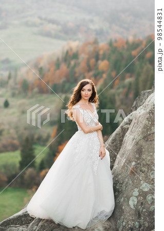 Beauty woman, bride with perfect white dress background mountains 98544831