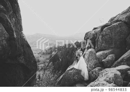 Loving husband and woman on the background of the mountains. Loving couple emotionally spends time 98544833
