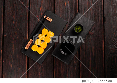 Sushi roll with cheese with chopsticks top view - asian Japanese food concept 98545001