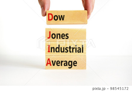 DJIA Dow Jones industrial average symbol. Concept words DJIA Dow Jones industrial average on wooden block on beautiful white background. Business DJIA Dow Jones industrial average concept. Copy space DJIA Dow Jones industrial average symbol. Concept words DJIA Dow Jones industrial average on wooden block on beautiful white background. Business DJIA Dow Jones industrial average concept. Copy space 98545172