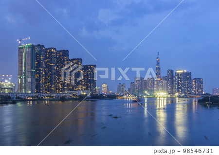 Saigon, Vietnam - Oct 24, 2022 - Impression landscape of Ho Chi Minh city at night, Saigon river flows through the city. High-quality photo. High-quality photo Saigon, Vietnam - Oct 24, 2022 - Impression landscape of Ho Chi Minh city at night, Saigon river flows through the city. High-quality photo. High-quality photo 98546731