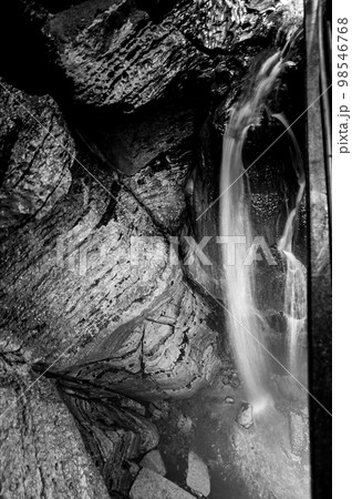 Flowing waterfall underground in Niagara Cave, MN 98546768