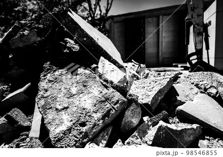 Sidewalk being replaced and old slabs broken and pilled at construction site. Sidewalk being replaced and old slabs broken and pilled at construction site. 98546855