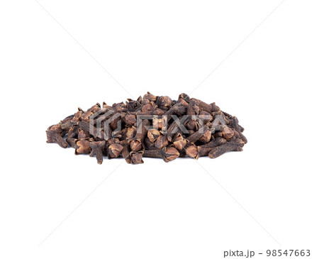 A bunch of dried unopened cloves on a white background. 98547663