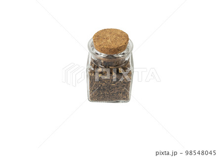Valerian herb root in a glass jar isolated on white background. Valeriana officinalis. used in herbal medicine as a tranquillizer and to treat insomnia, anxiety, hypertension, pain relief. 98548045