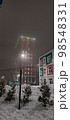 colored apartment buildings in the fog in night 98548331