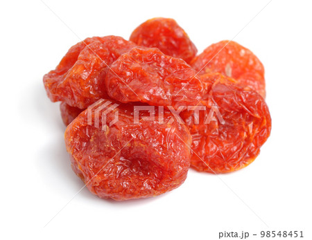 Whole sweet dried tomatoes. Isolated on white background 98548451